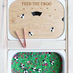 Feed the Frog laser engraved wood sensory tray with bug loose parts and pink tweezers, fitting an IKEA Trofast bin.