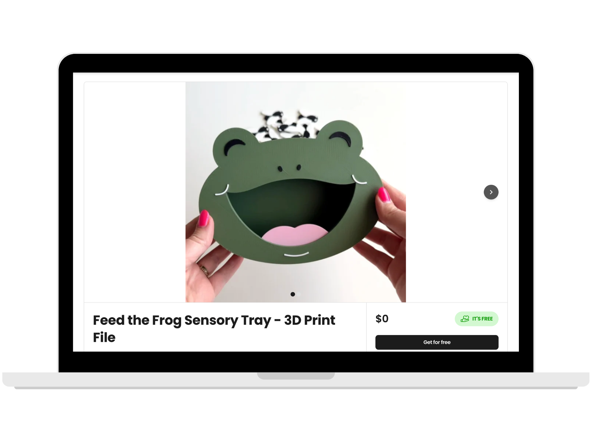A laptop displaying a product listing for the Feed the Frog Sensory Tray 3D print file, priced at free, with a product photo of hands holding a green 3D printed frog face insert.